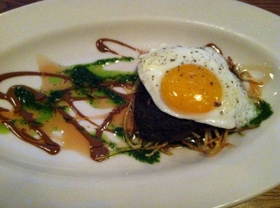 Girl & The Goat signature dishes Roasted Pig Face
Sticky Glazed Pork Shank
Goat Empanadas